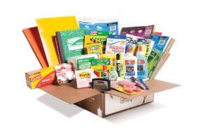 Edukit box opened, full of school supplies