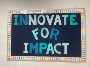A sign that says Innovate for Impact