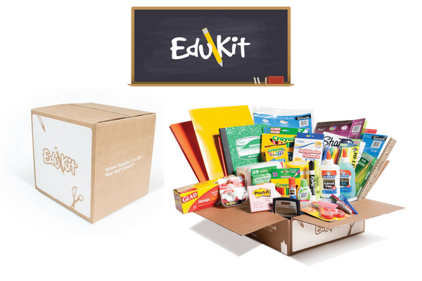 image of a cardboard box full of school supplies with "EduKit" written on a chalkboard